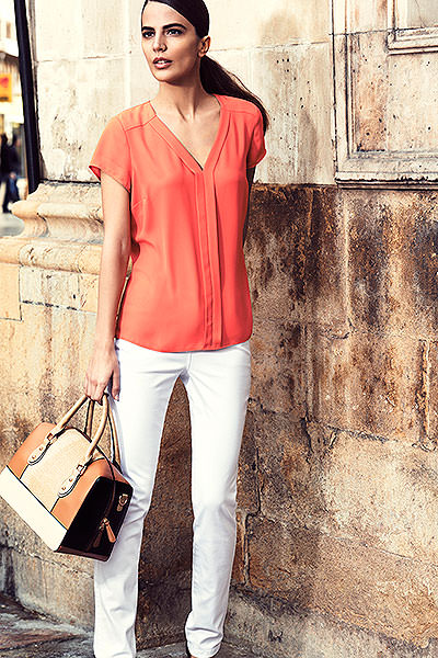 Orange sleeveless blouse £18 White cotton jeggings £18 Tan barrel bag £26